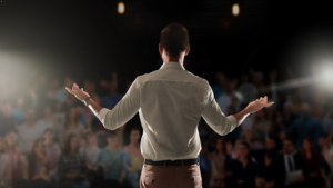 Leader inspiring a group with a motivational speech, embodying leadership and empowerment.
