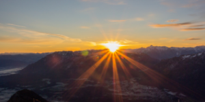 Sunrise over a mountain range, symbolizing vision, hope, and the power of purpose-driven leadership.